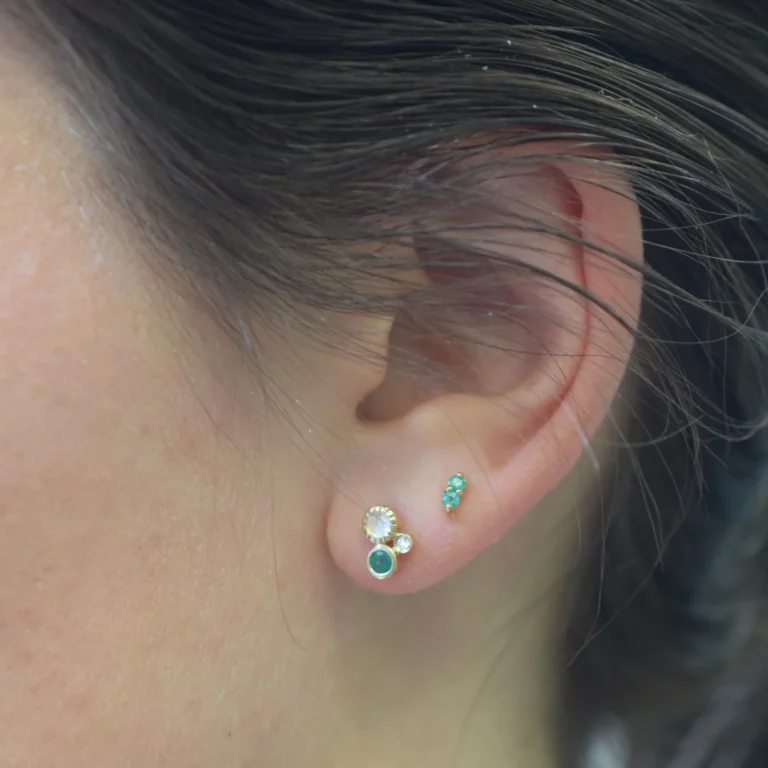 Emerald Pavillion Studs and Emerald, Rainbow and Diamond Cluster Studs, both by La Kaiser at Moondance Jewelry Gallery